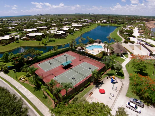 an aerial view of residential houses with outdoor space
