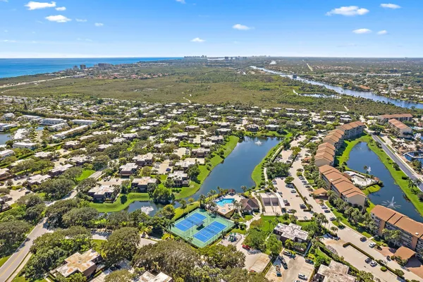 an aerial view of residential houses with outdoor space