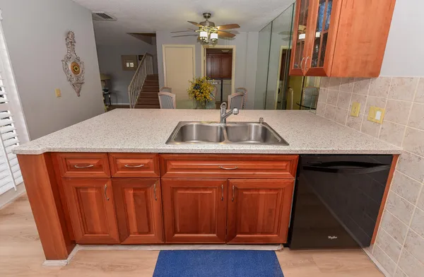 a bathroom with a sink a mirror and vanity