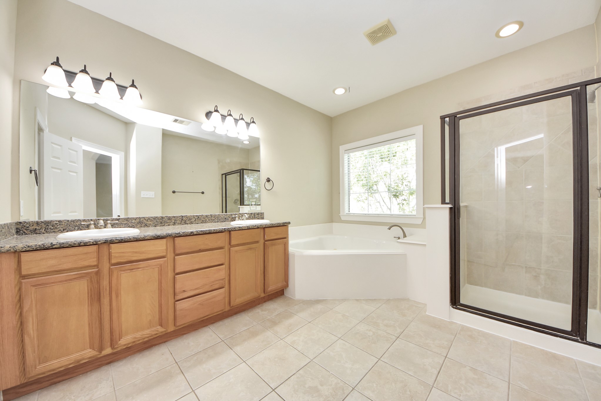 2119 Stuart Street Houston, TX 77004 - Photo 23 of 37 The 11'8"x10' ensuite bathroom is luxurious!