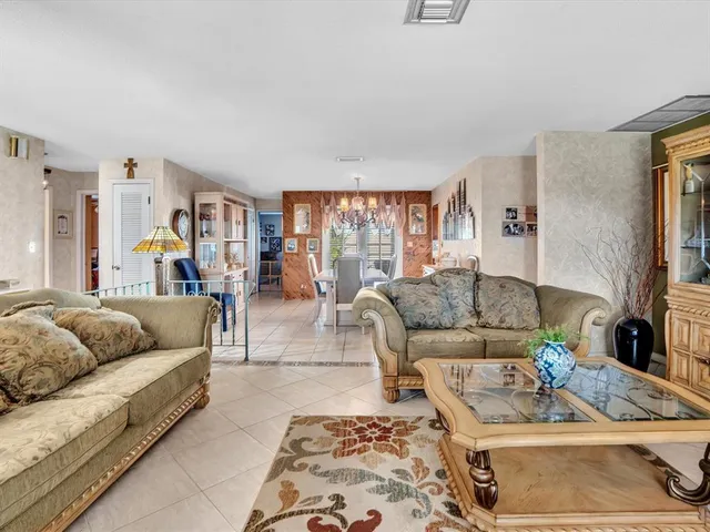 a dining table chairs and a kitchen view
