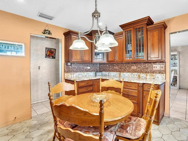 a kitchen with a sink and a granite counter tops