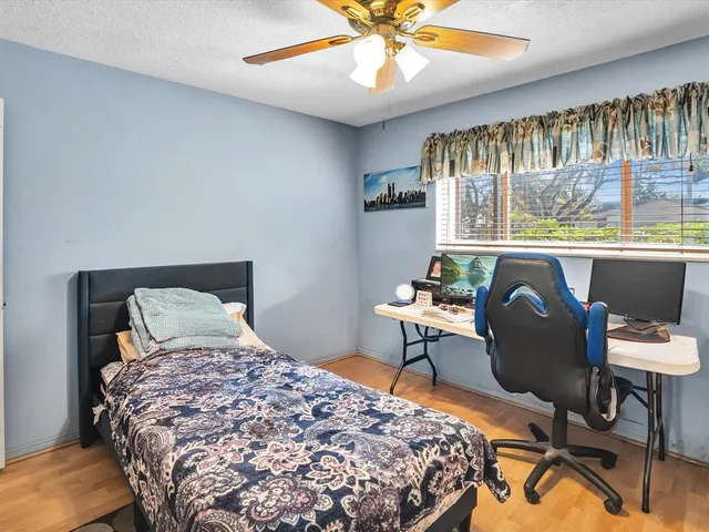 a bed room with a bed and a dresser