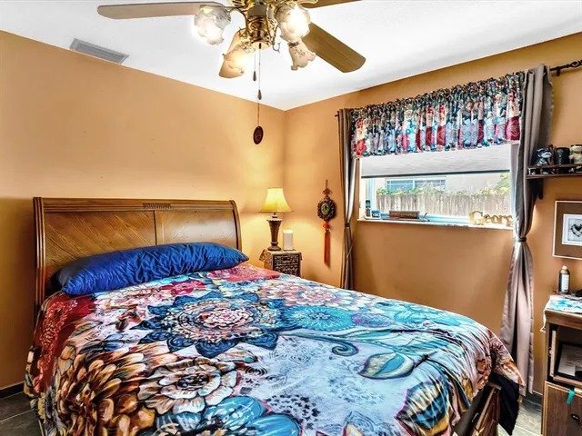 a view of a dining room with furniture and a chandelier