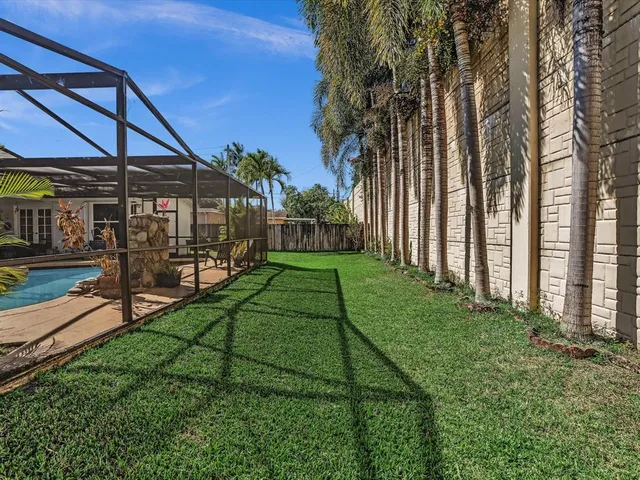 a view of backyard with a garden and plants
