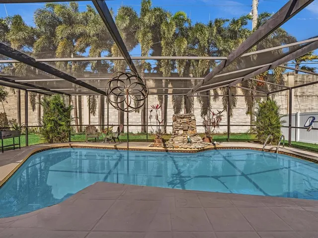 a view of a swimming pool with a yard