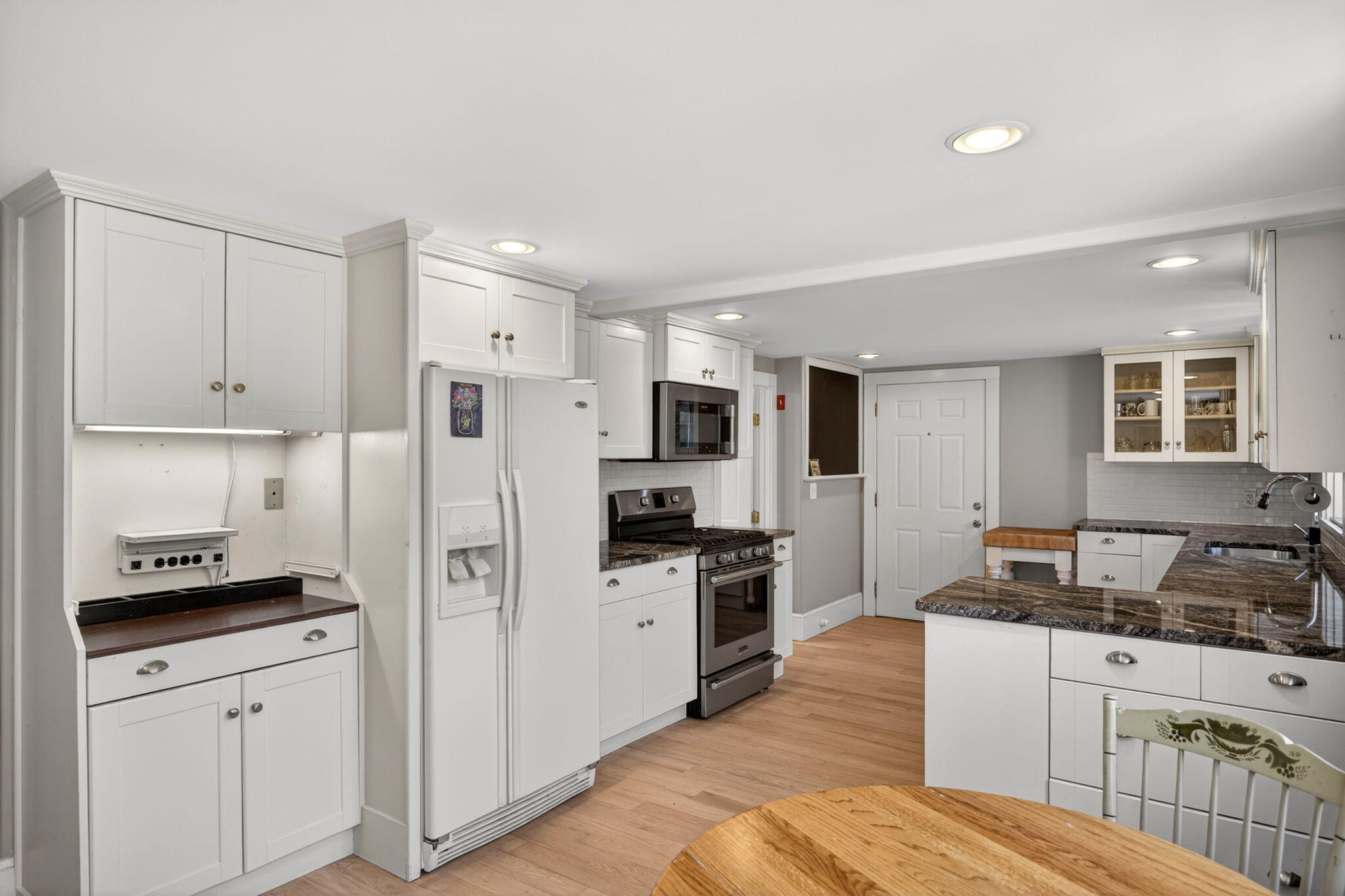 69 County Road Bourne, MA 02532 - Photo 12 of 54 a kitchen with granite countertop a refrigerator stove top oven and sink