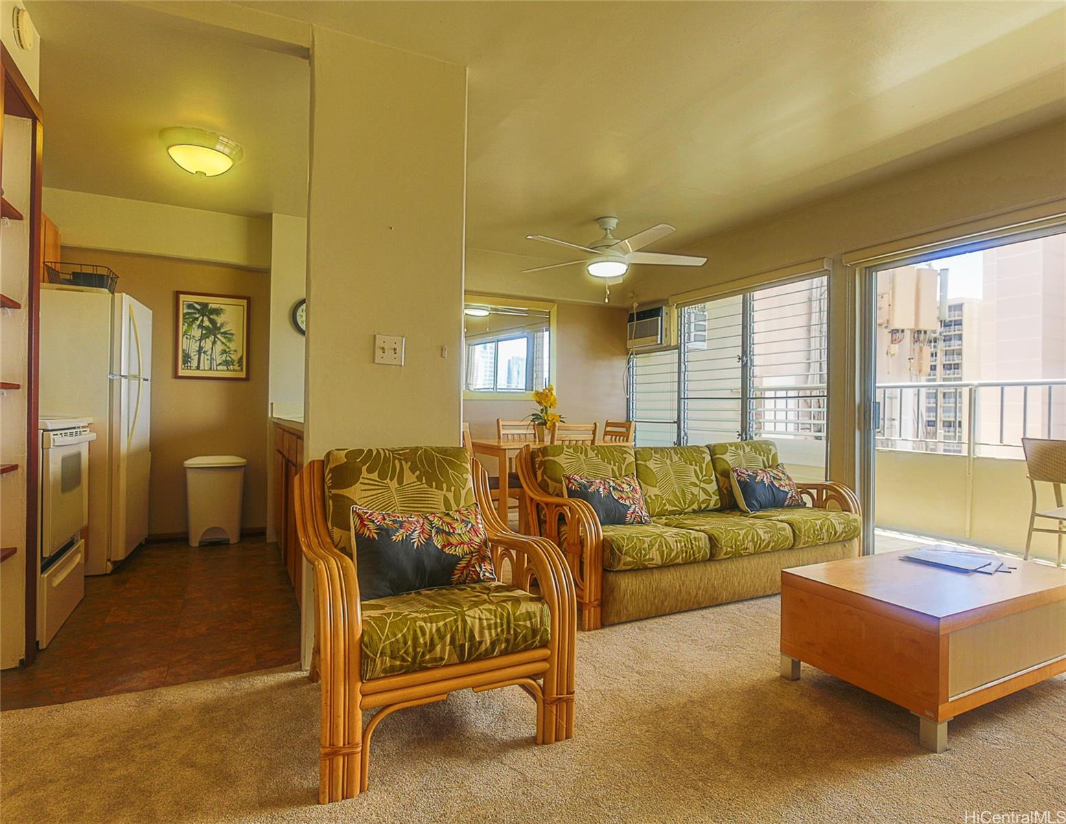 1690 Ala Moana Boulevard, Unit 1105 Honolulu, HI 96815 - Photo 12 of 13 a living room with furniture and a large window