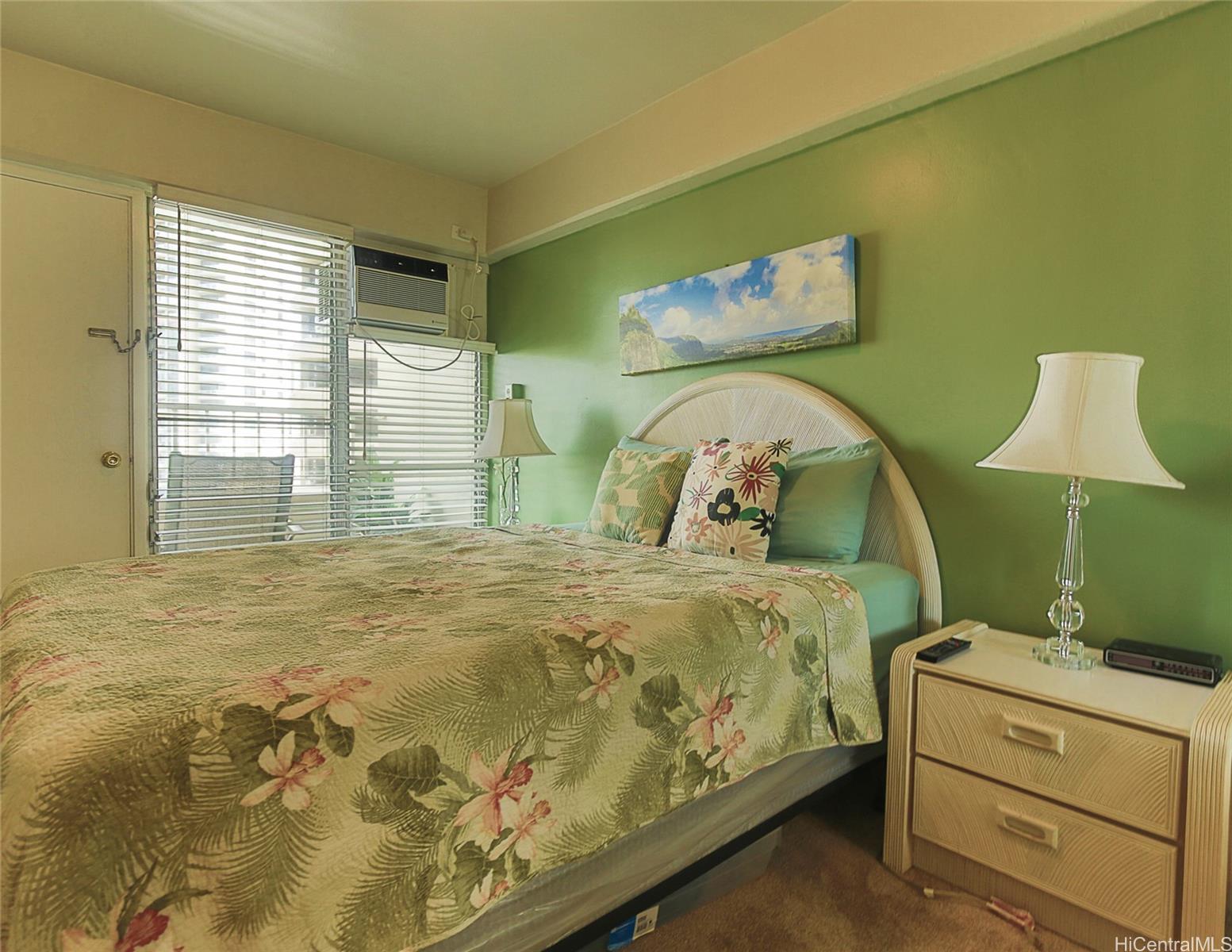 1690 Ala Moana Boulevard, Unit 1105 Honolulu, HI 96815 - Photo 13 of 13 a bedroom with a bed and a window