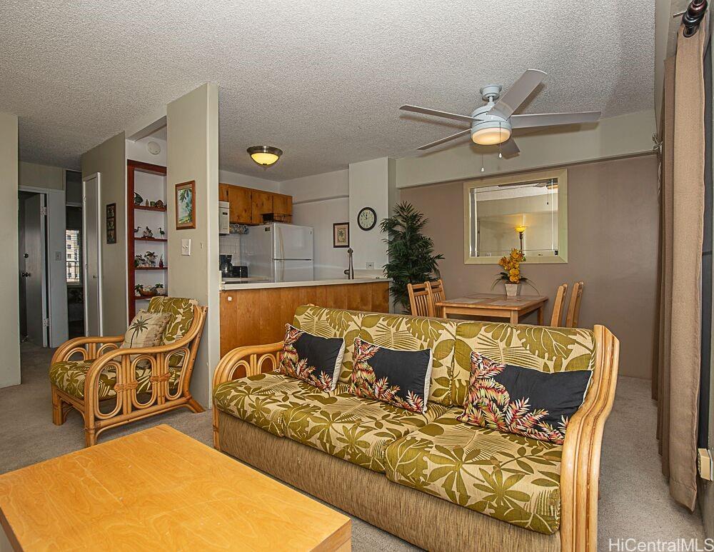 1690 Ala Moana Boulevard, Unit 1105 Honolulu, HI 96815 - Photo 9 of 13 a living room with furniture