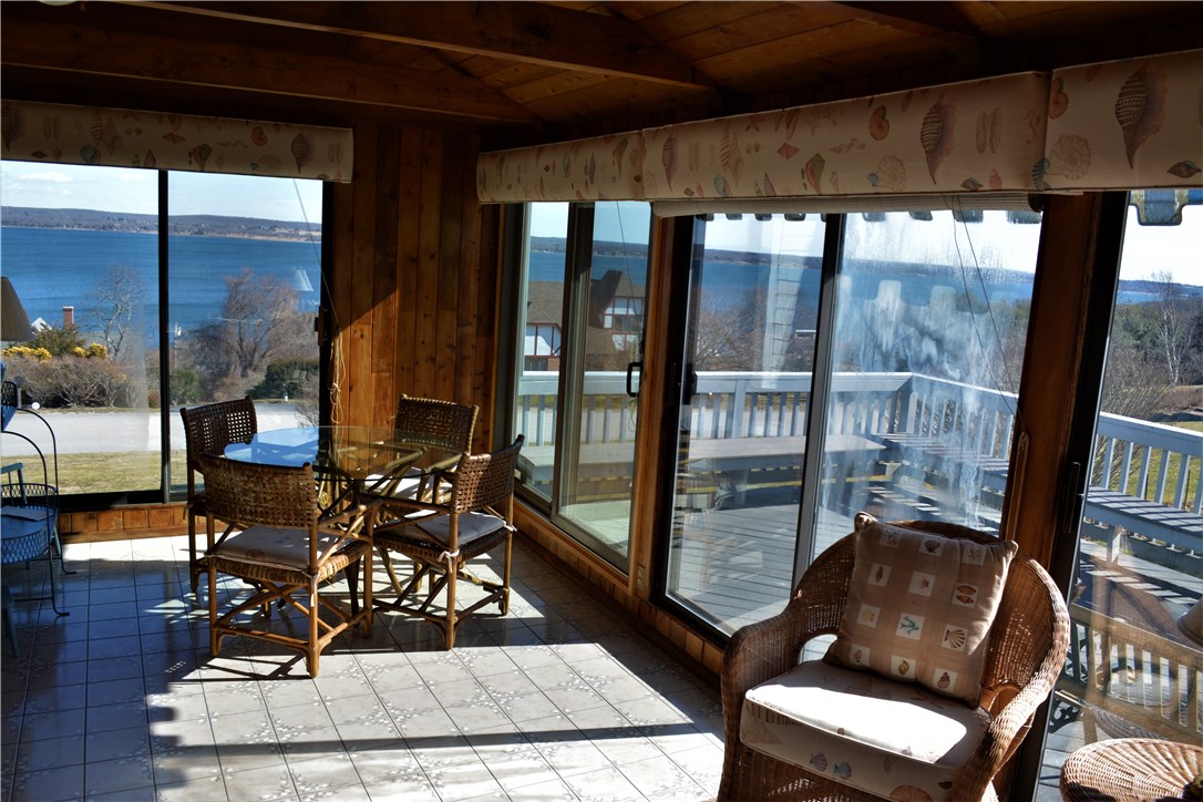 187 Lepes Road Portsmouth, RI 02871 - Photo 16 of 33 Heated sun porch off the kitchen takes advantage of those waterviews.