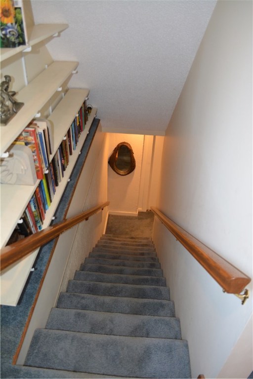 187 Lepes Road Portsmouth, RI 02871 - Photo 25 of 33 Stairway from first floor to lower level walkout with in-law apartment