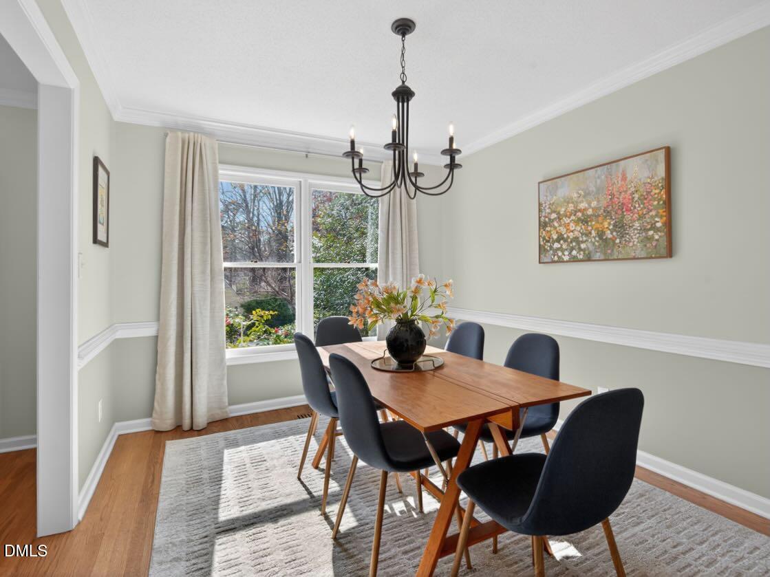 212 Old Fox Trail Durham, NC 27713 - Photo 16 of 35 a view of a dining room with furniture window and wooden floor