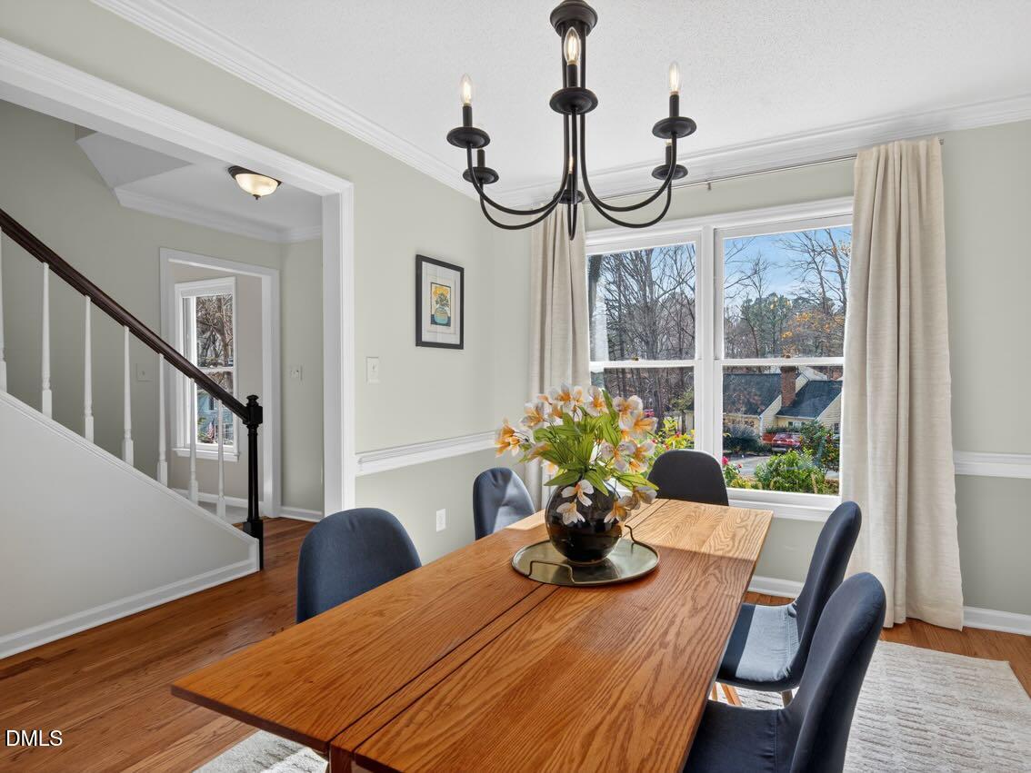 212 Old Fox Trail Durham, NC 27713 - Photo 17 of 35 a view of a dining room with furniture window and wooden floor