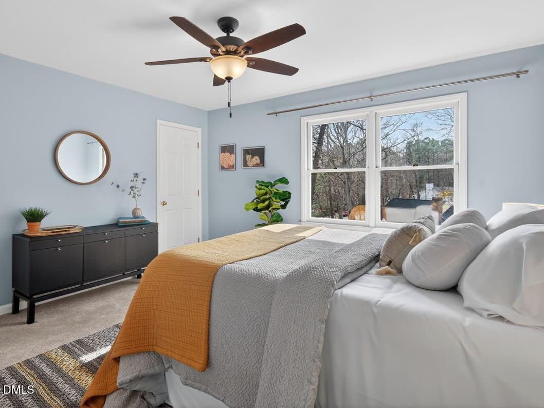 212 Old Fox Trail Durham, NC 27713 - Photo 22 of 35 a bedroom with a bed and a large window