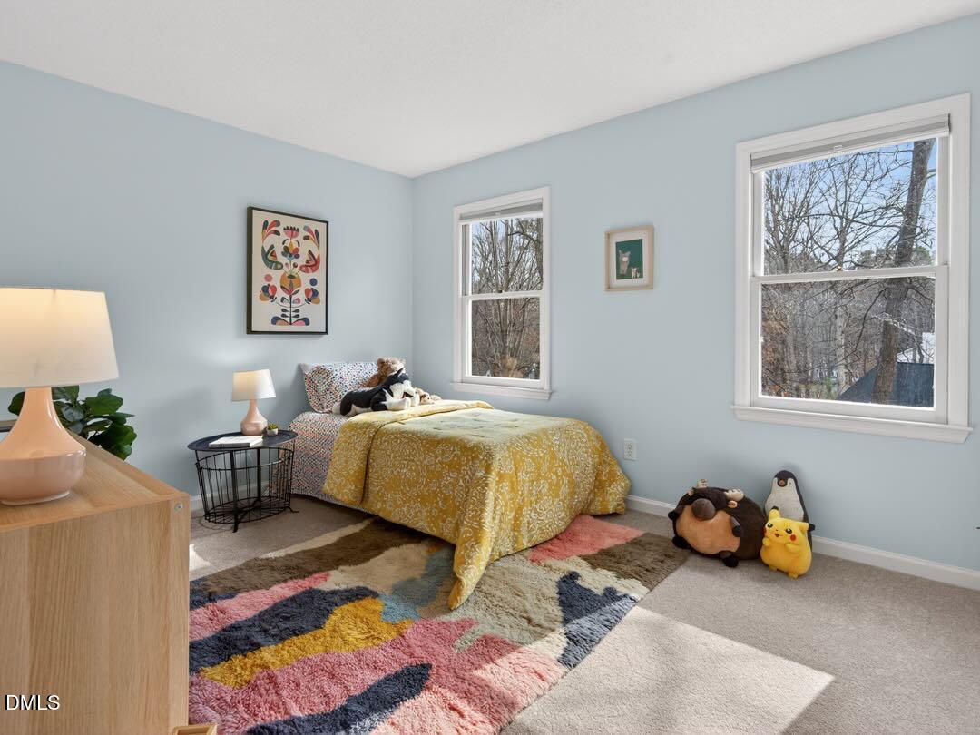212 Old Fox Trail Durham, NC 27713 - Photo 23 of 35 a spacious bedroom with a bed and a window