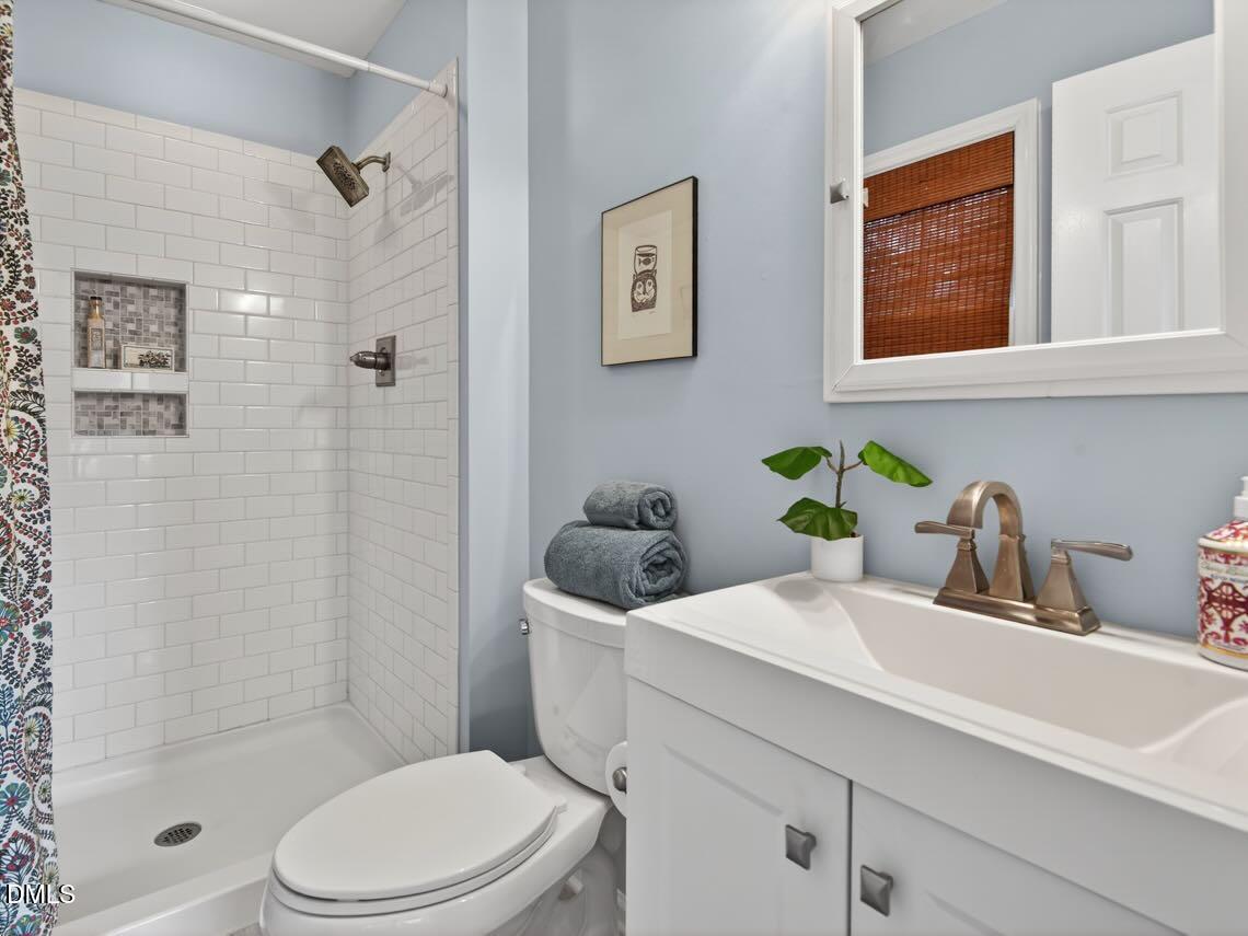 212 Old Fox Trail Durham, NC 27713 - Photo 26 of 35 a bathroom with a sink a toilet and shower