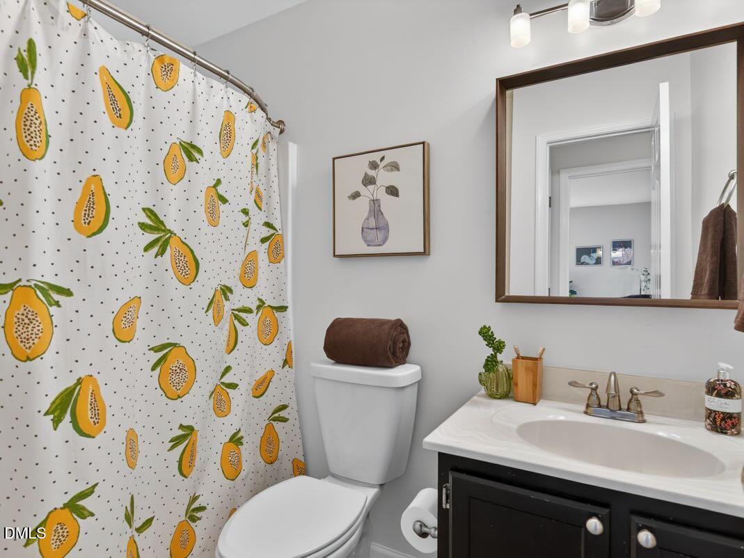 212 Old Fox Trail Durham, NC 27713 - Photo 27 of 35 a bathroom with a granite countertop toilet sink and mirror