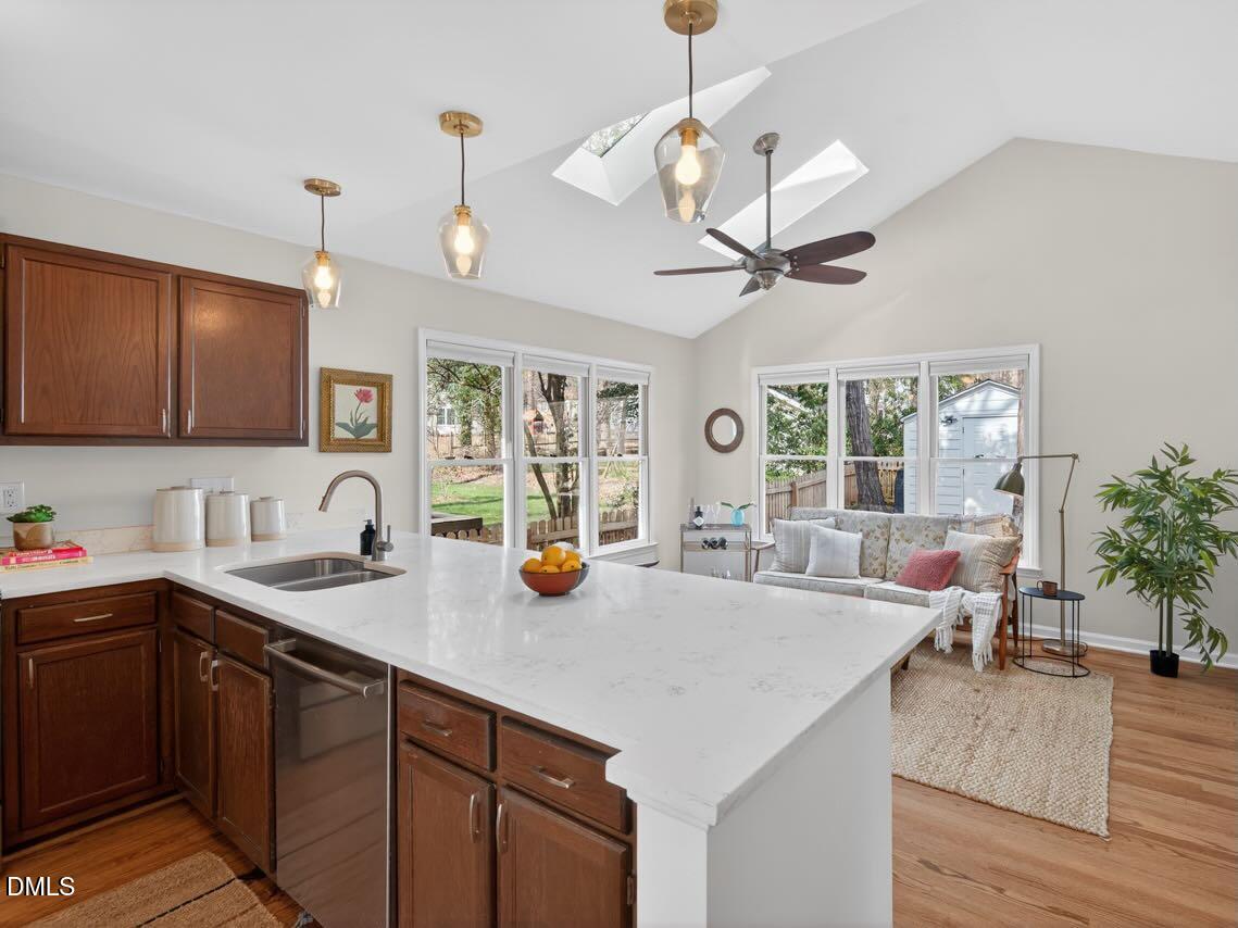 212 Old Fox Trail Durham, NC 27713 - Photo 3 of 35 a view of center island of a kitchen with granite countertop living room
