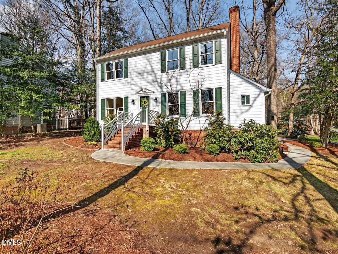 212 Old Fox Trail Durham, NC 27713 - Photo 35 of 35 a front view of a house with a yard and potted plants