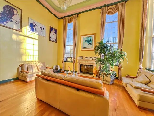 a living room with patio furniture and a large window