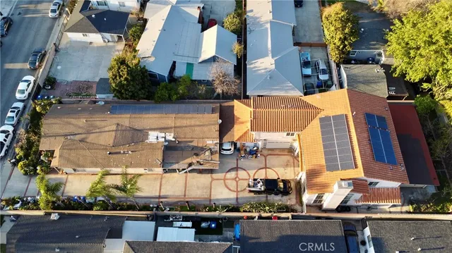 an aerial view of houses with outdoor space