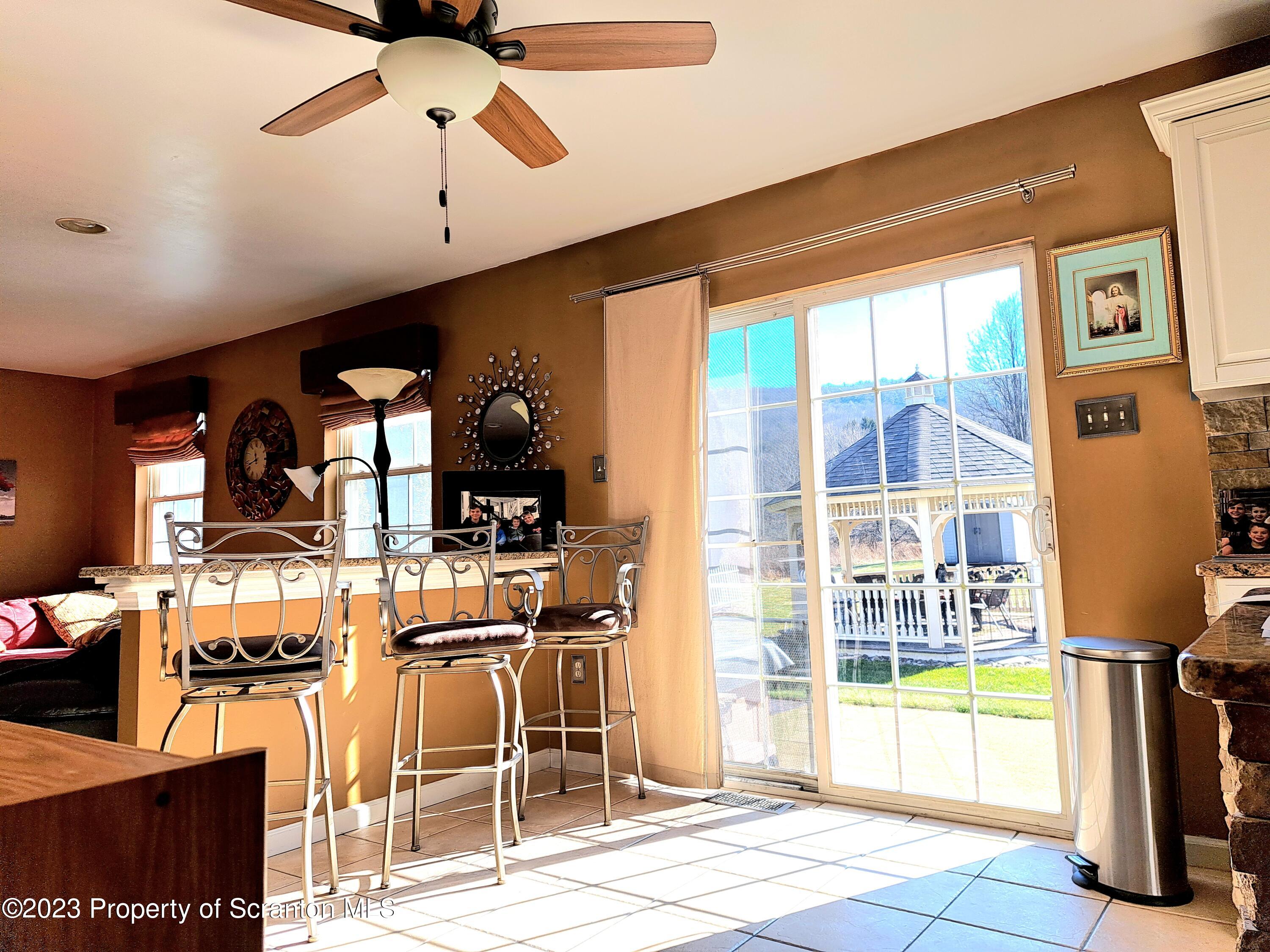 987 Chase Road Shavertown, PA 18708 - Photo 19 of 70 a room with lots of white furniture and a chandelier