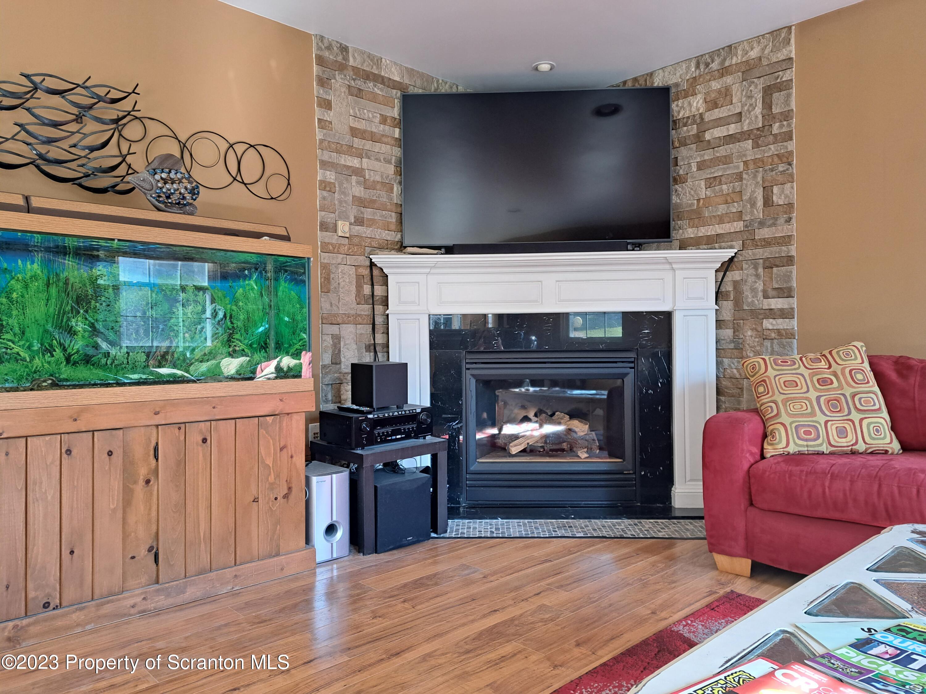 987 Chase Road Shavertown, PA 18708 - Photo 21 of 70 a living room with furniture and a fireplace