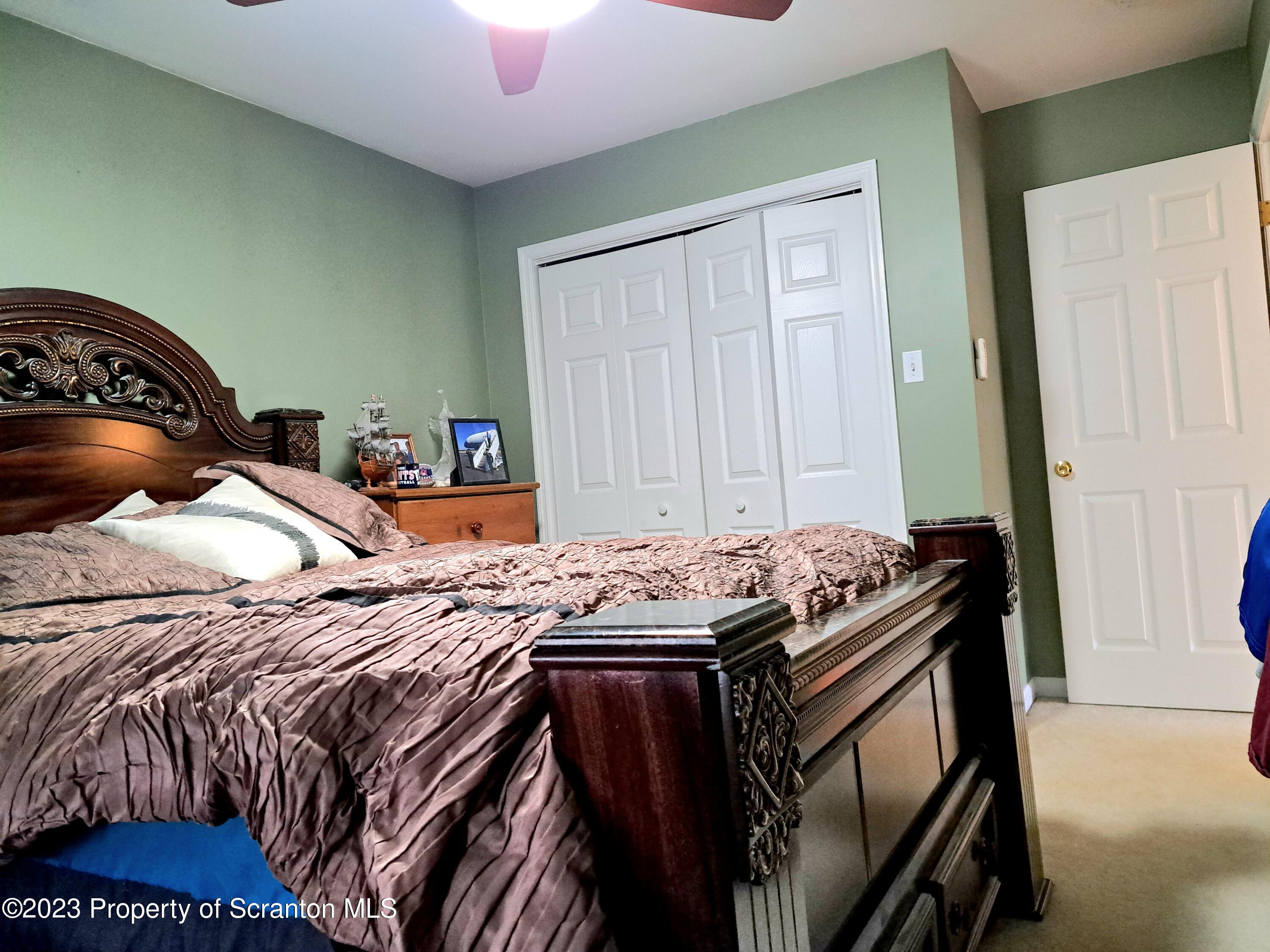 987 Chase Road Shavertown, PA 18708 - Photo 48 of 70 a bed sitting in a bedroom next to a window