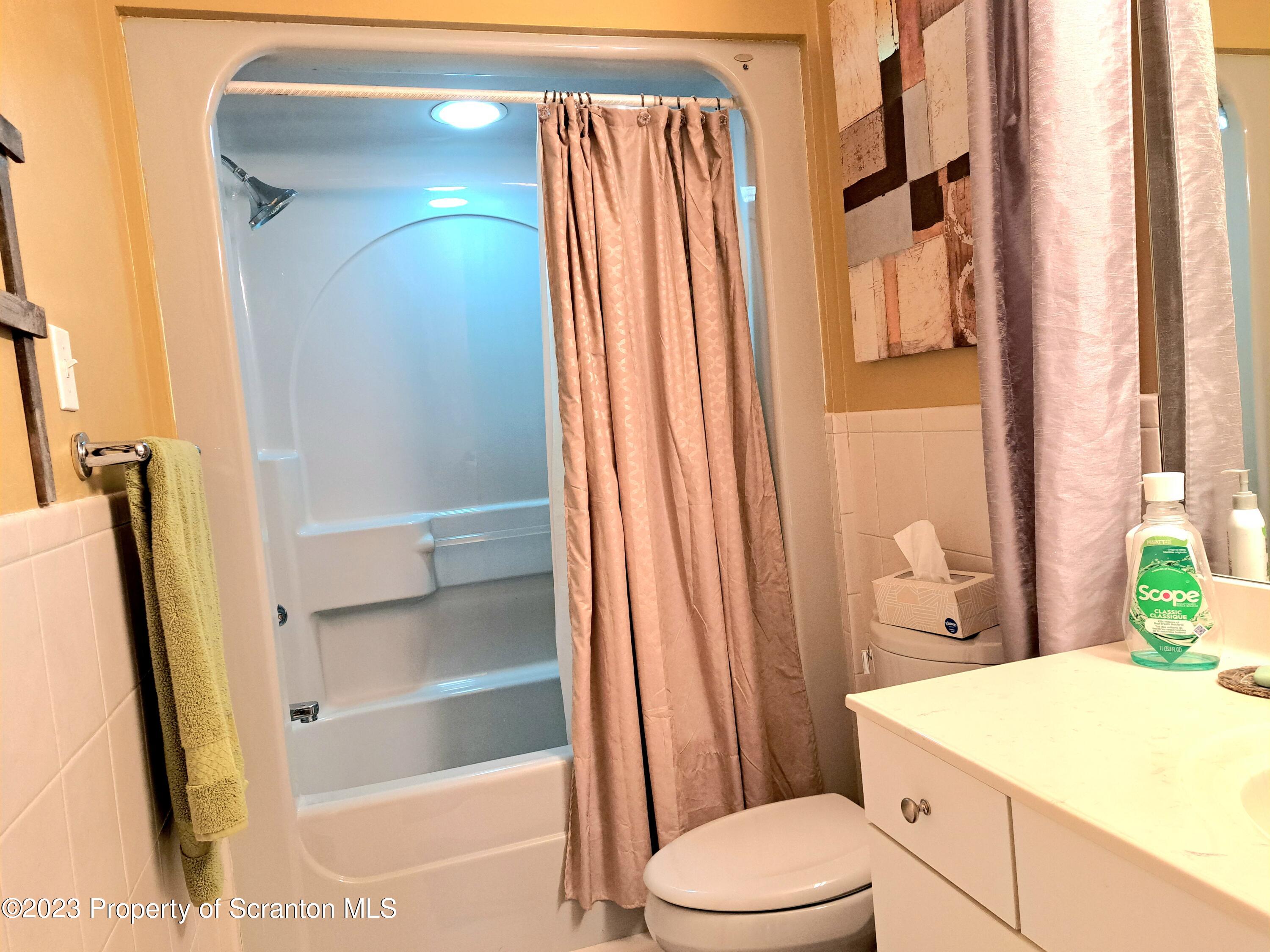 987 Chase Road Shavertown, PA 18708 - Photo 52 of 70 a bathroom with a sink a toilet and shower