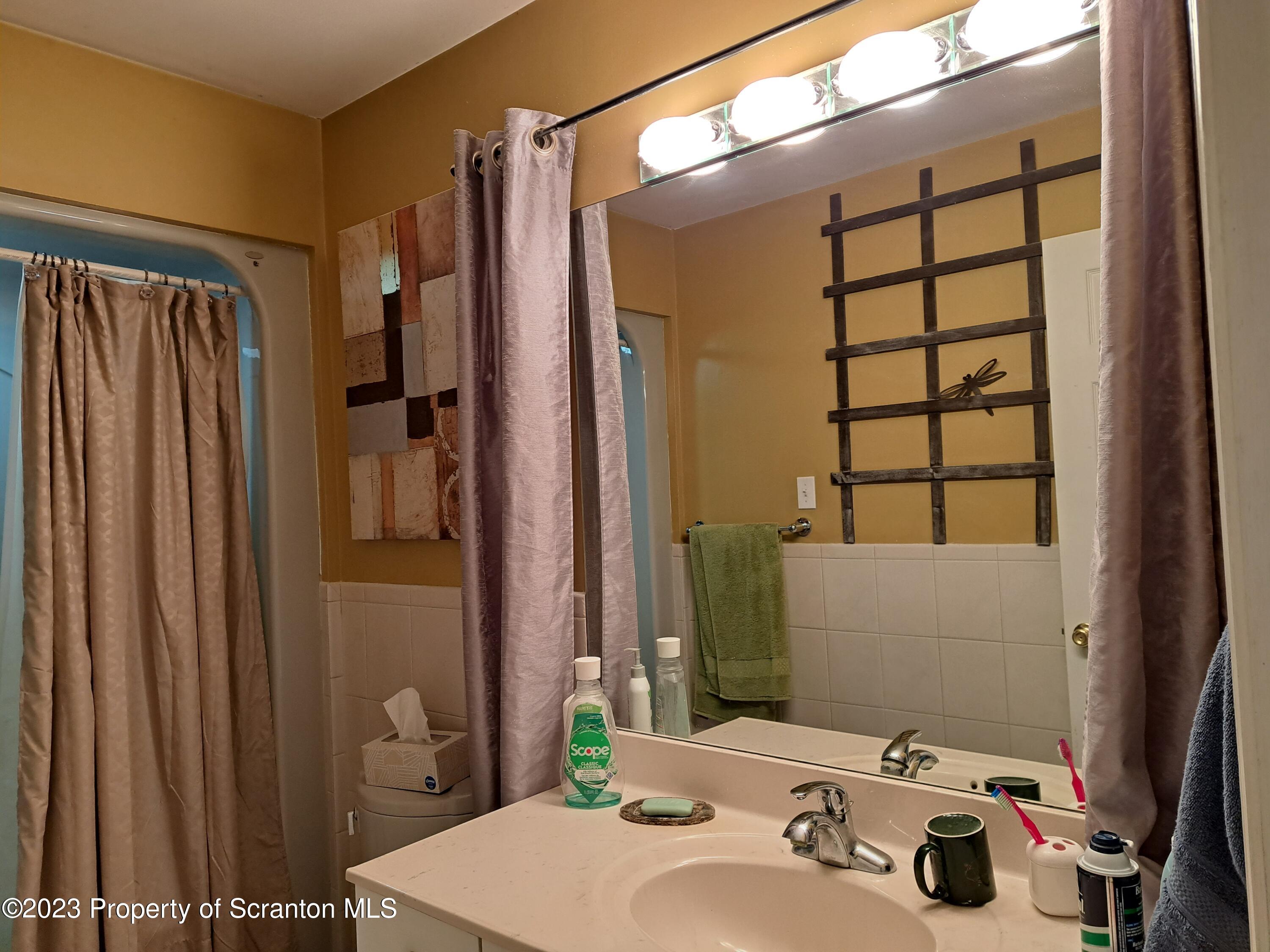 987 Chase Road Shavertown, PA 18708 - Photo 55 of 70 a bathroom with a sink toilet and shower