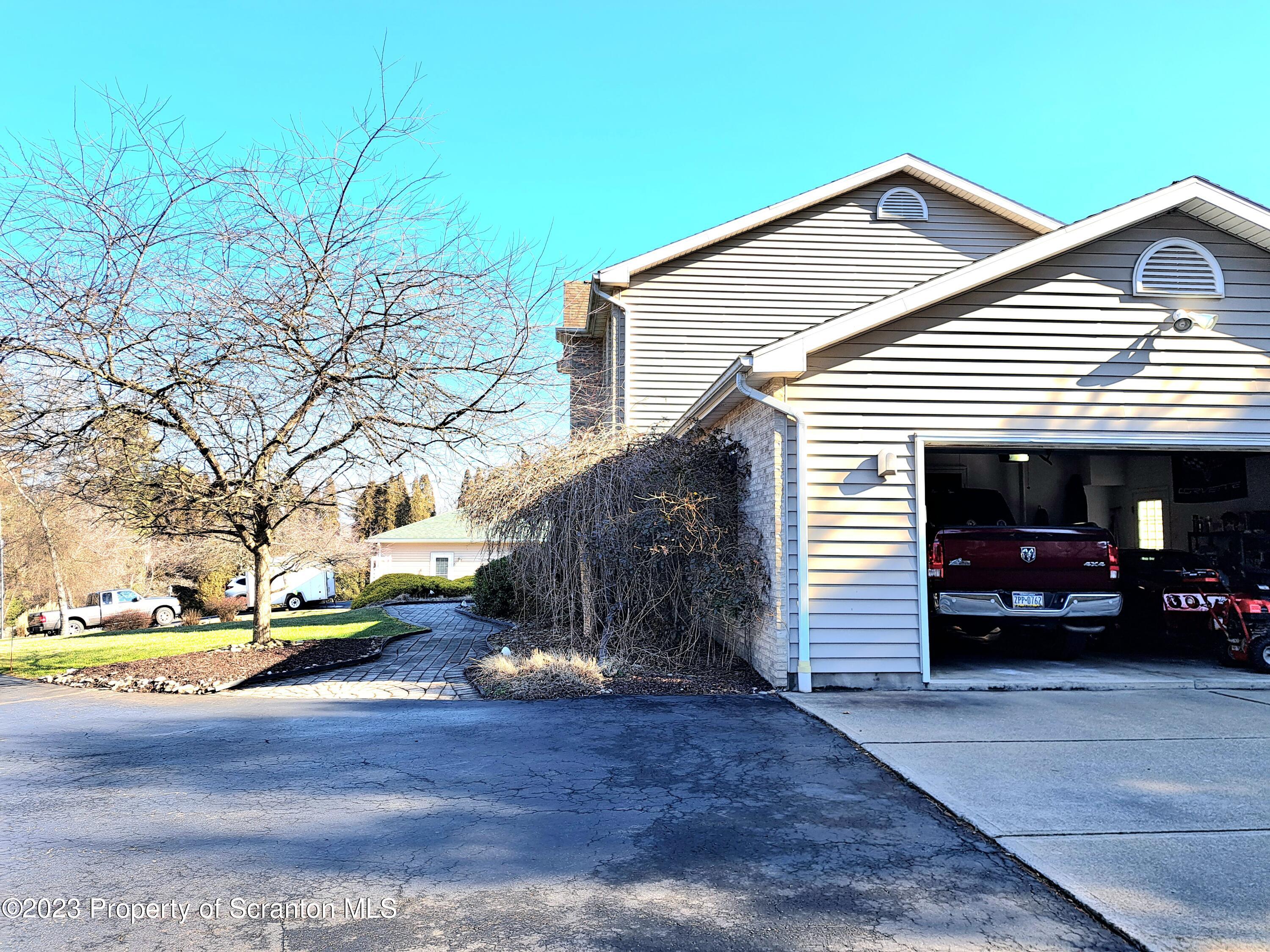 987 Chase Road Shavertown, PA 18708 - Photo 65 of 70 a view of a house with a yard and garage