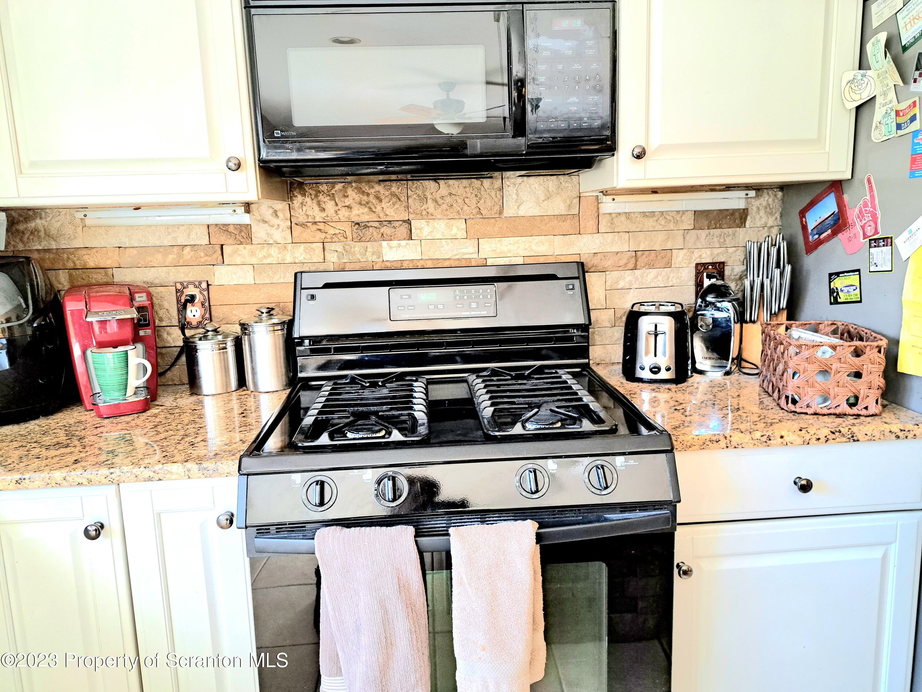 987 Chase Road Shavertown, PA 18708 - Photo 10 of 70 a stove top oven sitting inside of a kitchen