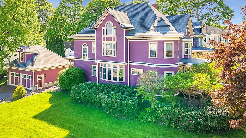 front view of a house with a yard