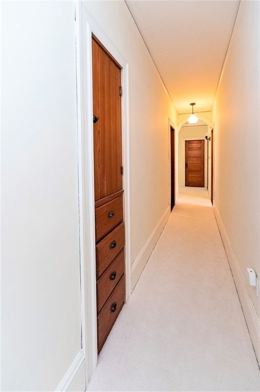 265 Water Street Clinton, MA 01510 - Photo 15 of 30 a view of a hallway with closet and a fireplace