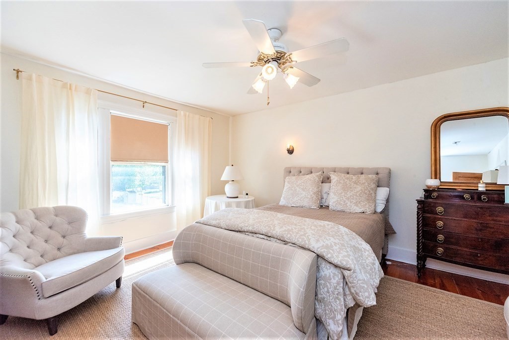 265 Water Street Clinton, MA 01510 - Photo 16 of 30 a spacious bedroom with a bed and couch