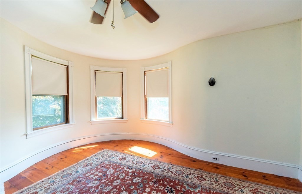 265 Water Street Clinton, MA 01510 - Photo 19 of 30 wooden floor in an empty room with a window