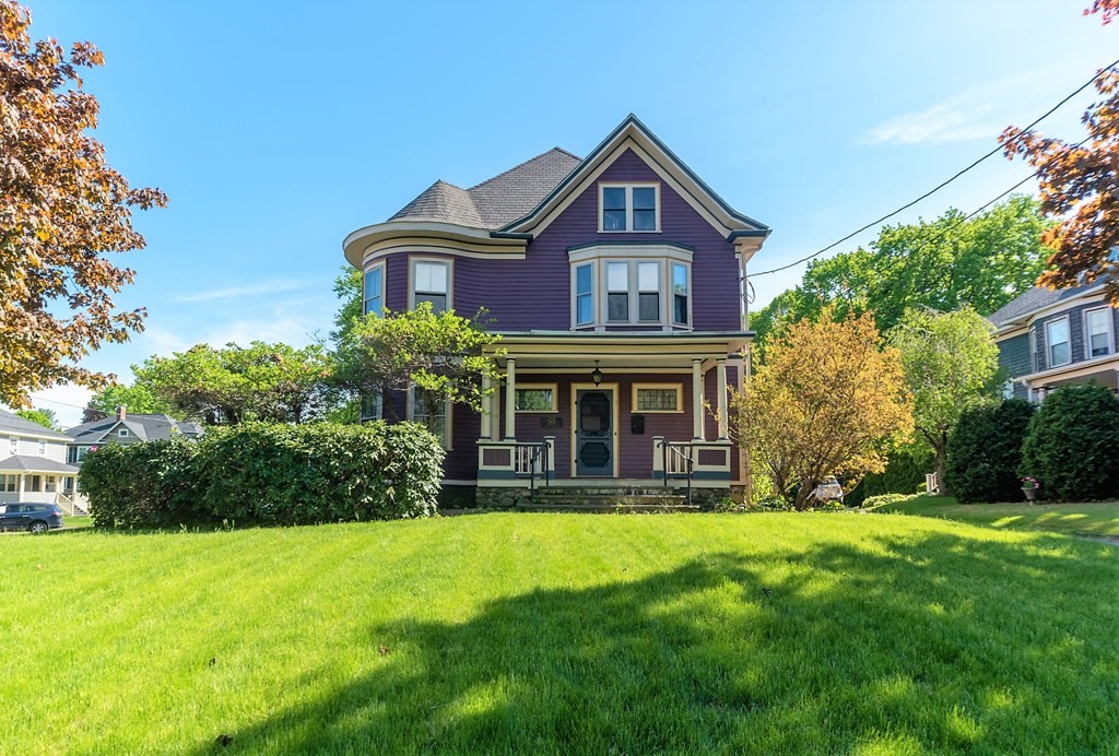 265 Water Street Clinton, MA 01510 - Photo 2 of 30 a front view of a house with garden