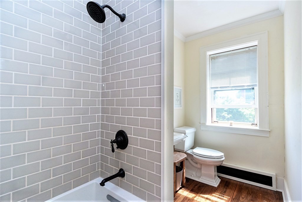 265 Water Street Clinton, MA 01510 - Photo 22 of 30 a bathroom with a toilet and a shower
