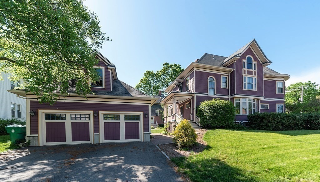 265 Water Street Clinton, MA 01510 - Photo 26 of 30 a front view of a house with a yard and garage