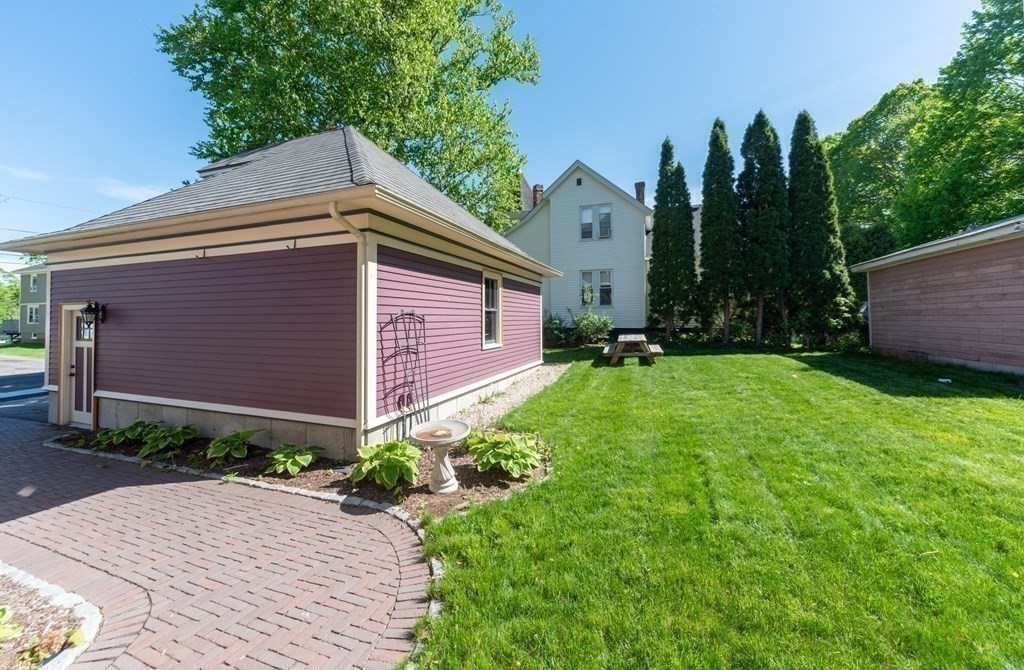 265 Water Street Clinton, MA 01510 - Photo 27 of 30 a backyard of a house with lots of green space