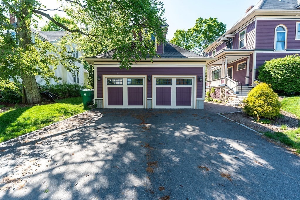 265 Water Street Clinton, MA 01510 - Photo 3 of 30 a front view of a house with a yard and potted plants