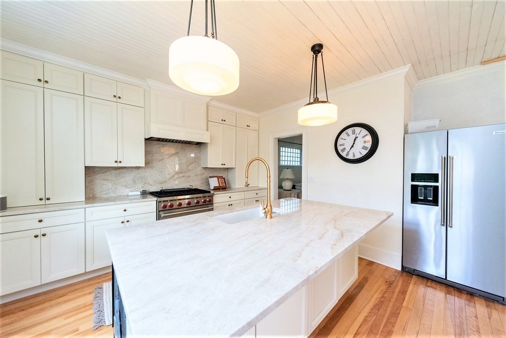 265 Water Street Clinton, MA 01510 - Photo 5 of 30 a kitchen with stainless steel appliances a stove a refrigerator and a window