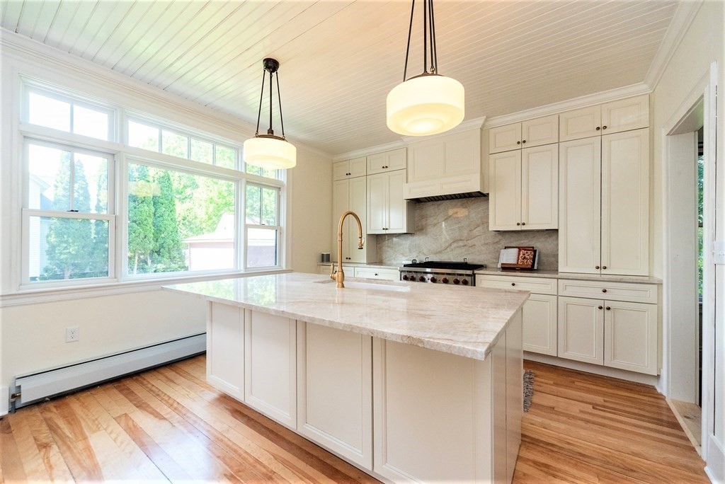 265 Water Street Clinton, MA 01510 - Photo 6 of 30 a kitchen with a stove window and cabinets