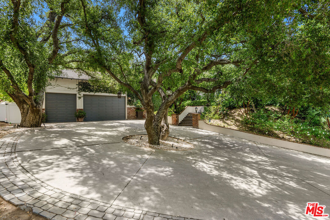 204 Bell Cyn Road Bell Canyon, CA 91307 - Photo 3 of 75 a front view of a house with a tree