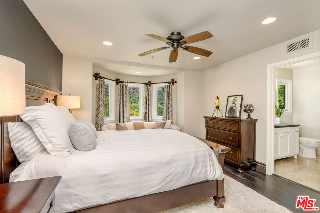204 Bell Cyn Road Bell Canyon, CA 91307 - Photo 36 of 75 a bedroom with a bed and wooden floor