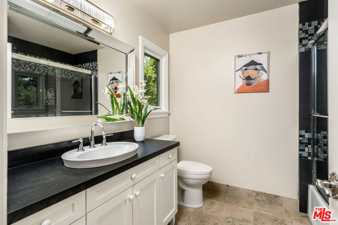 204 Bell Cyn Road Bell Canyon, CA 91307 - Photo 38 of 75 a bathroom with a sink and a mirror