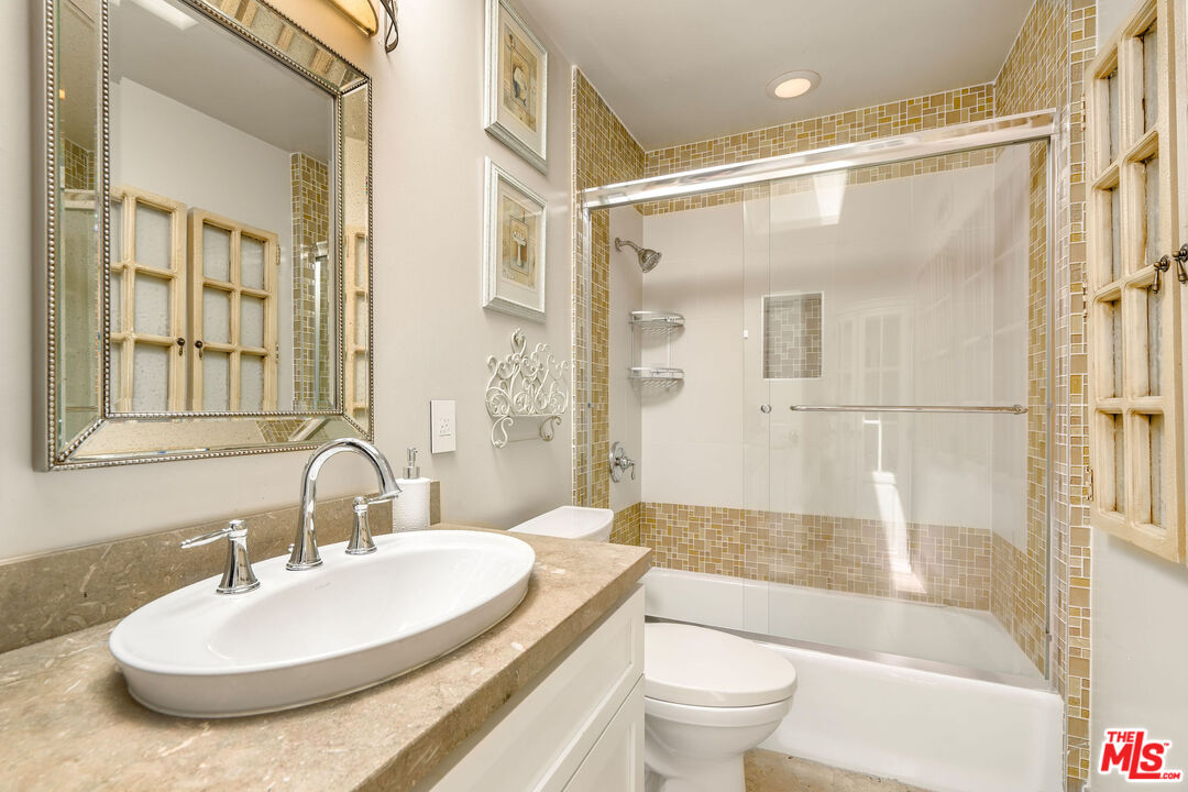 204 Bell Cyn Road Bell Canyon, CA 91307 - Photo 40 of 75 a bathroom with a sink and a mirror