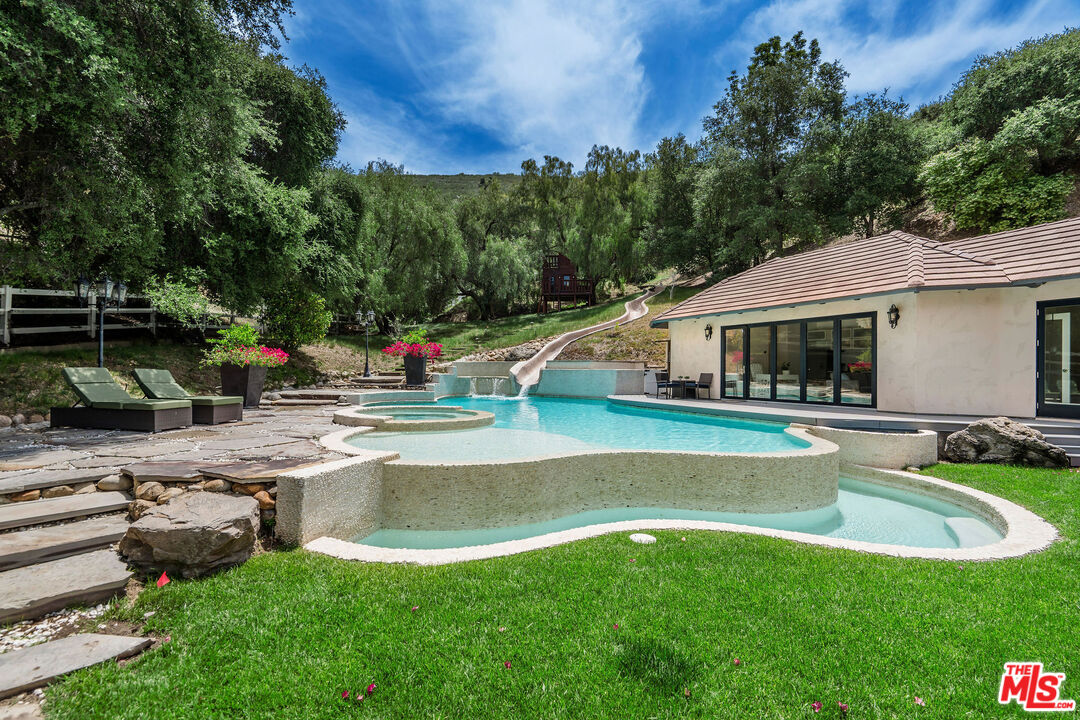 204 Bell Cyn Road Bell Canyon, CA 91307 - Photo 50 of 75 a view of a house with swimming pool and a yard