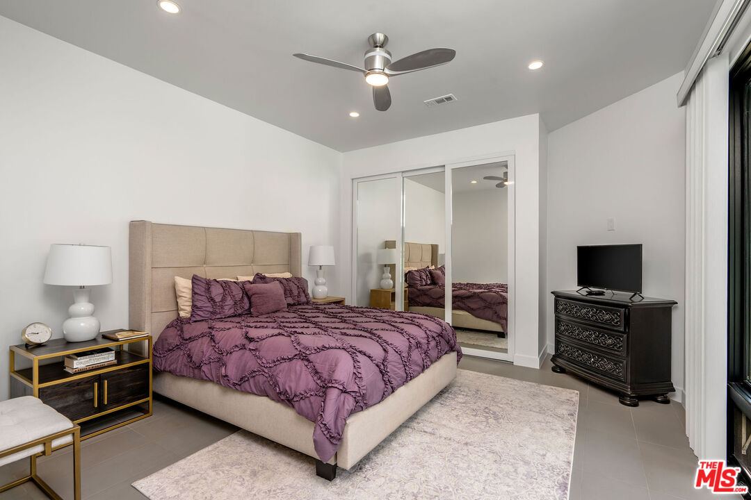 204 Bell Cyn Road Bell Canyon, CA 91307 - Photo 56 of 75 a bedroom with a bed and a flat screen tv